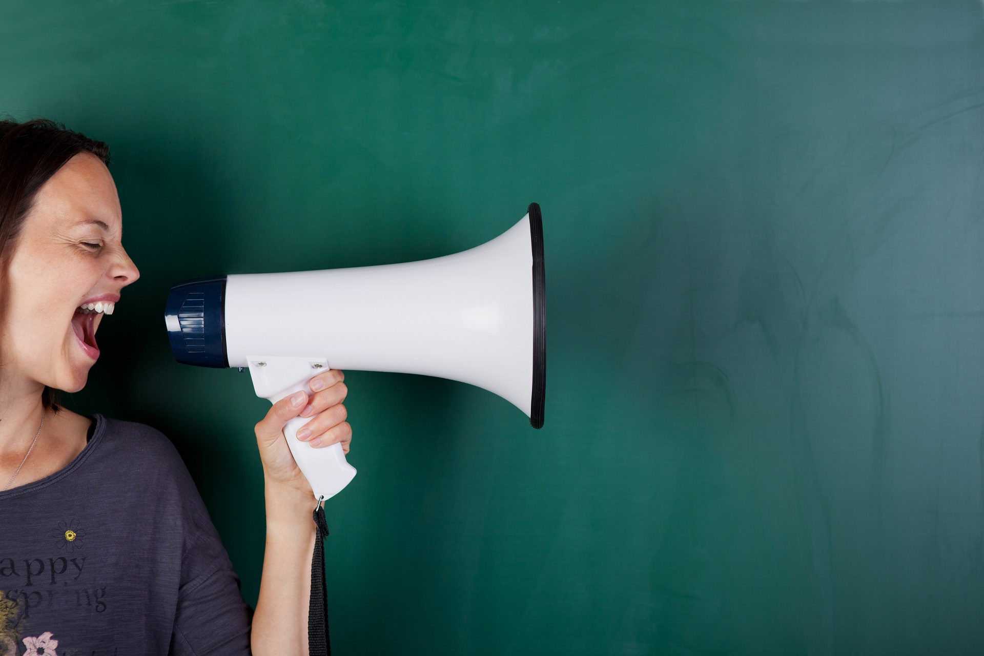 A woman yelling into a megaphone